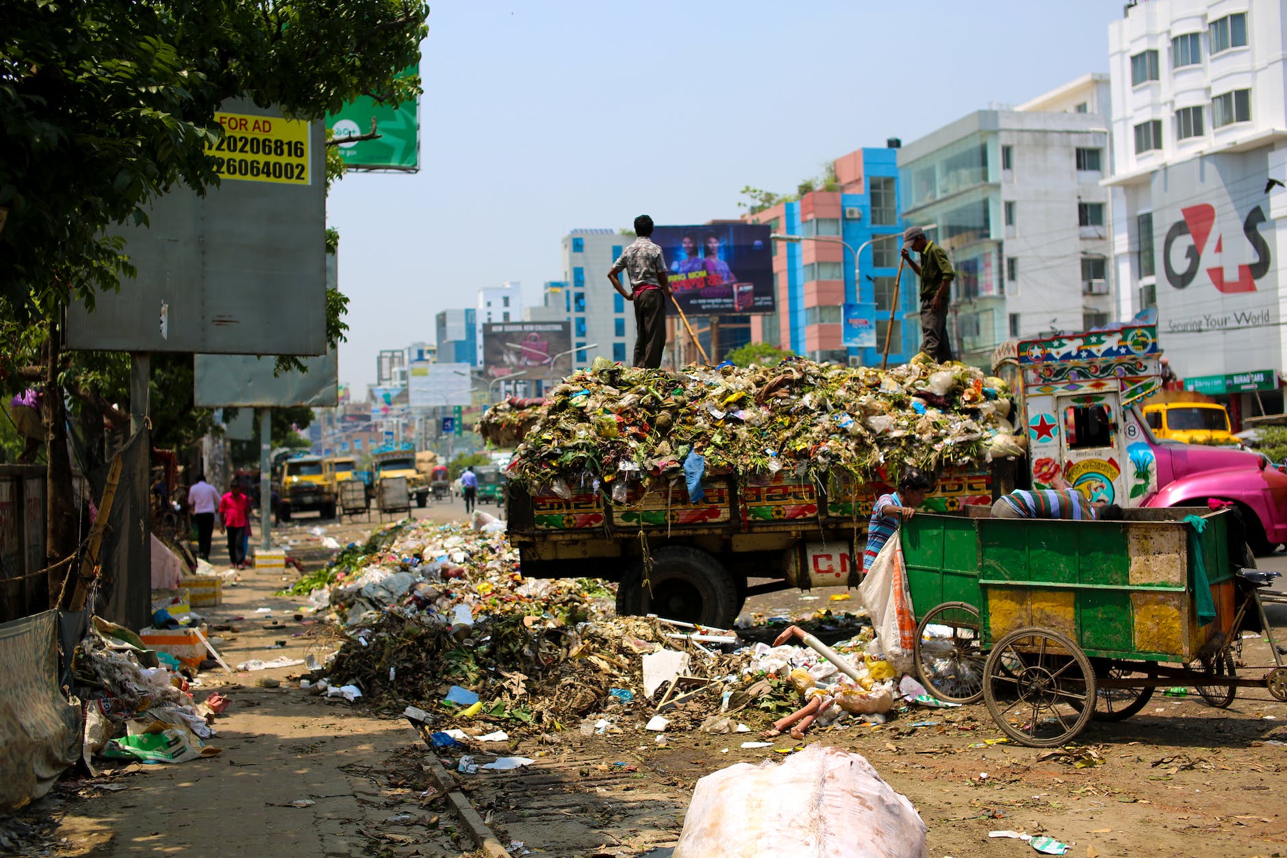 photo of a dump truck across buildings