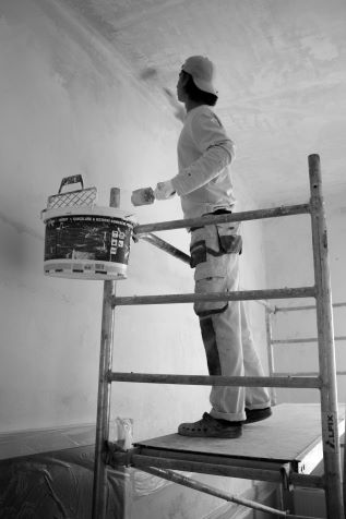 Painter Painting a Home