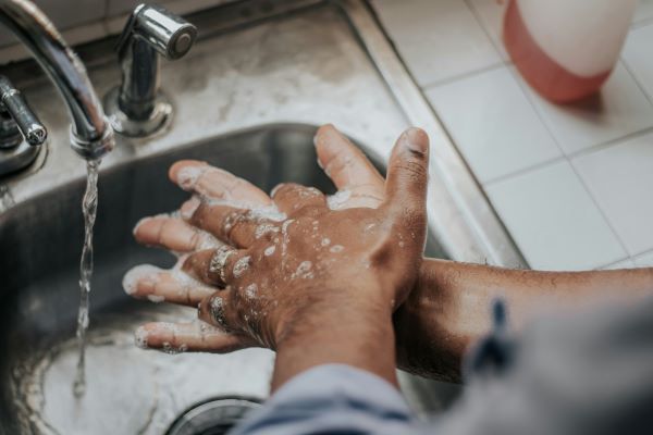 A person washing hands